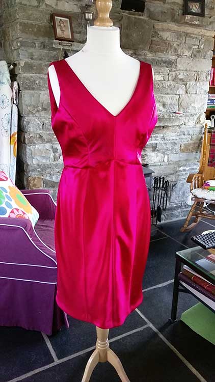 restyled and repurposed red silk dress on mannequin