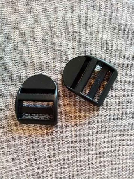 Plastic strap adjuster, tabbed (25mm)