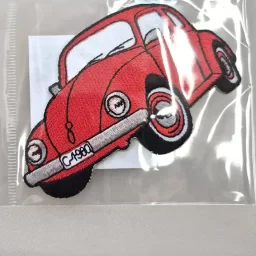 Red beetle car iron-on embroidered patch, 5 x 12cm approx.